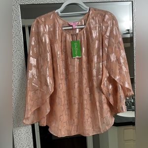 Womens size small Lilly blouse. Beautiful sleeves and design